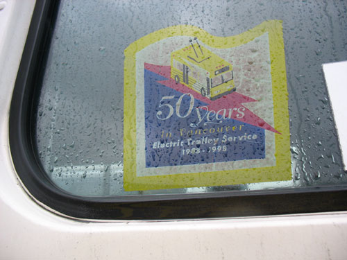 50 years of trolleys! A decal on the side of a trolley bus.
