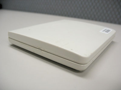 The transponder is a small plastic square, about 3 inches wide, 3.5 inches long, and 0.5 inches tall. 