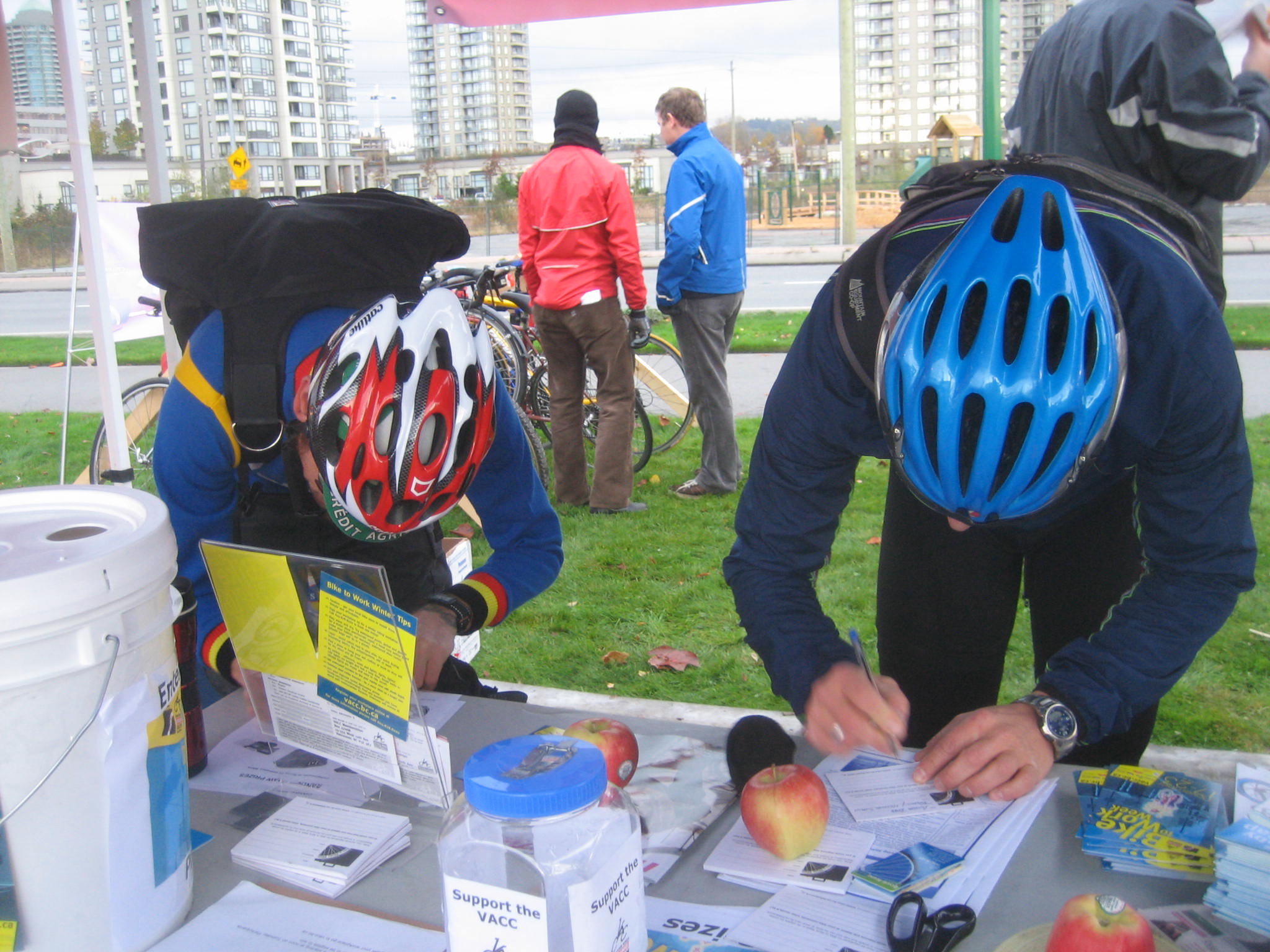Riders fill out entry forms for the commuter station prize draw.