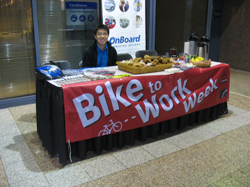 Paul Cheng from TransLink, watching over the treats at the Bike to Work Week commuter station in Metrotower II.