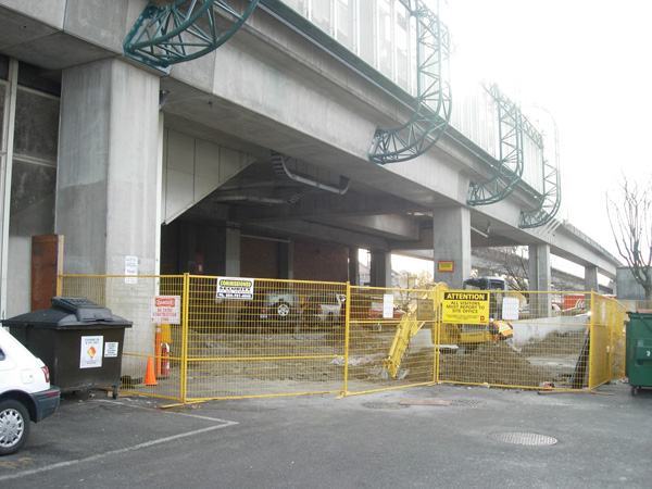 The chain-link fence under the station has been removed, as well as the TransLink garbage and recycling bins.