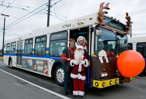 Santa and his friends with CMBC's reindeer bus!