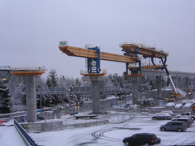 Snow falls as the Launching Truss nears YVR Station.