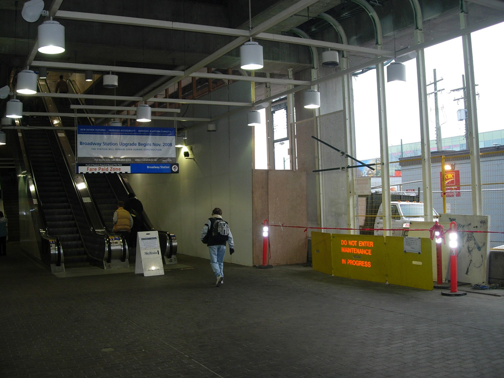 A view of Broadway Station's interior. Glass walls are being installed at the station -- the hoarding on the right is part of the ongoing installation of those walls.