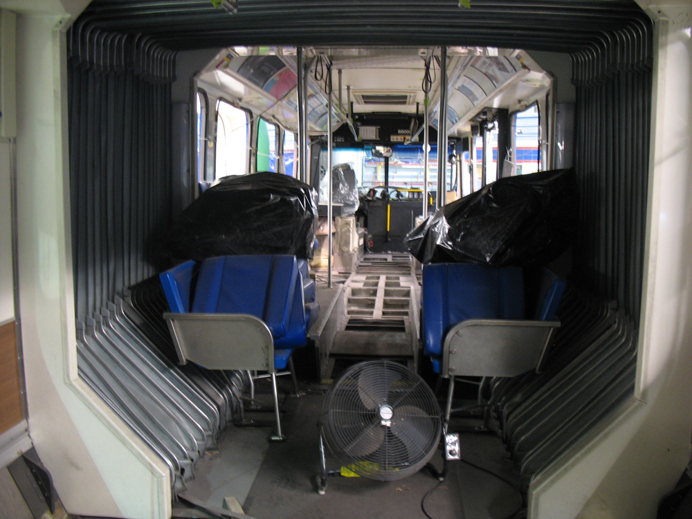 As I was standing inside the back of the bus, I also took a photo of the articulated joint interior and the empty floors up at the front of the vehicle.