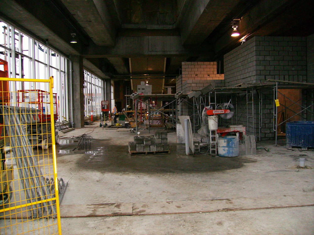 The concrete block walls at right are built to house the electrical and elevator rooms in the station.