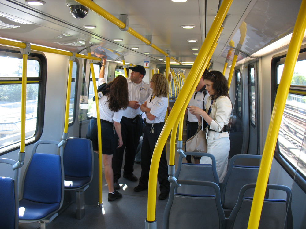 A few SkyTrain attendants took a moment to examine the new maps.
