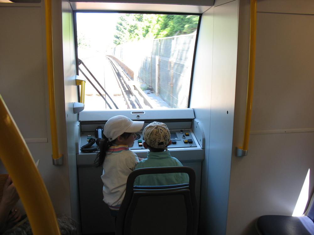 The first junior SkyTrain pilots aboard train #306! In the early part of the ride, the train had more SkyTrain and TransLink people onboard than actual passengers -- the kids above were a few of the lucky riders!