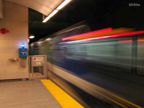 A Canada Line train breezes by Oakridge-41st Avenue Station. Photo by <a href=http://www.flickr.com/photos/stchou/3838672096/in/pool-canadaline>Steve Chou</a>.