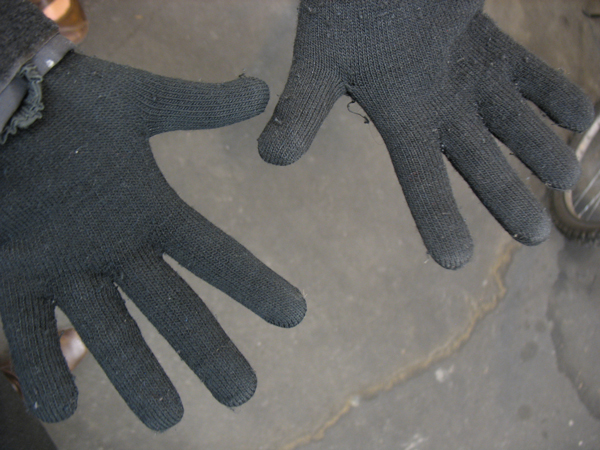 A cheap pair of stretchy gloves can keep your hands warm when cycling to work.