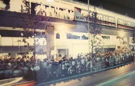 Passengers line-up outside Main Street SkyTrain Station during Expo 86. 