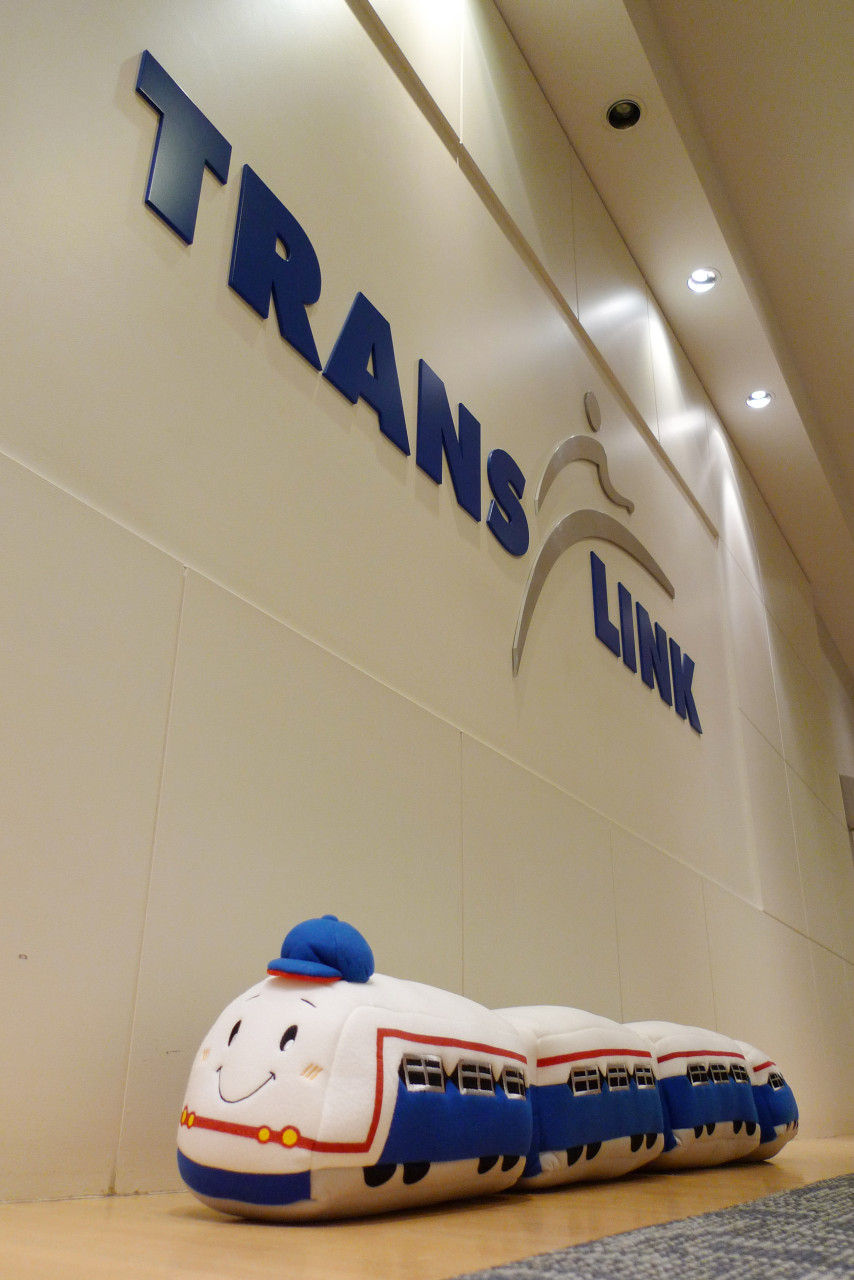 The Bangkok SkyTrain next to the TransLink logo in our front office hallway!