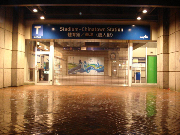 The station entrance name sign at Stadium-Chinatown Station. There’s also a T beacon on a pole outside.