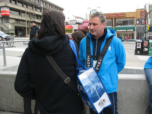 Transit host Marko helps out a customer at Broadway-City Hall.