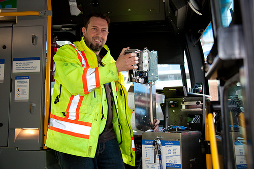 Shawn servicing a farebox while a bus is on layover