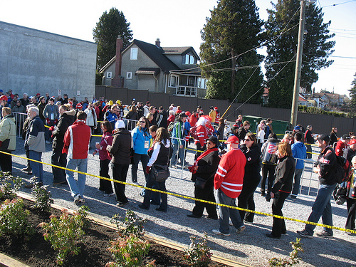 The crowds queueing for the Canada Line in the adjacent parking lot to King Edward Station.