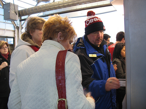 Mike helping out some new riders buy tickets for West Coast Express.