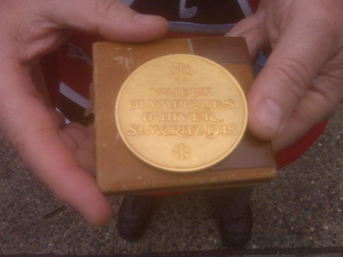 The front of the 1948 gold medal for hockey at the Winter Olympics.