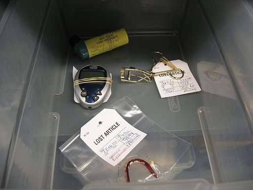 In the medical box, there was a blood glucose monitor, an inhaler, an eyelash curler, and a retainer.
