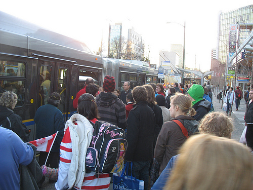 Riders board the westbound 99 B-Line at Cambie on Tuesday, February 16.