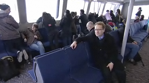 BBC reporter Adrian Warner rides the SeaBus. Screenshot from the BBC's clip about our transit system!