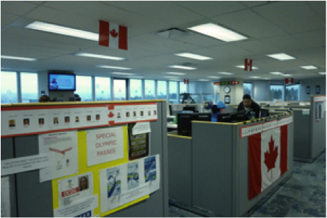 The call centre is filled with Olympic spirit: it's been decorated with Canadian flags, photos of Olympic athletes, pictures, posters, and useful maps of various Olympic sites. 