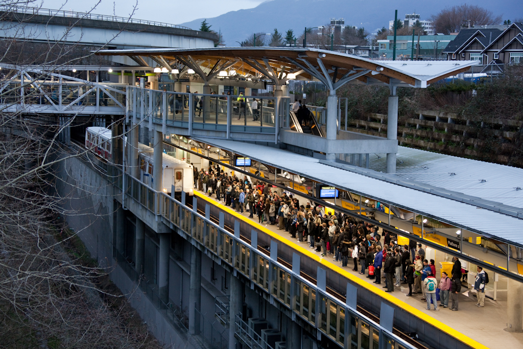 Crowds wait for Millennium Line trains at Commercial-Broadway Station on Friday, February 12.