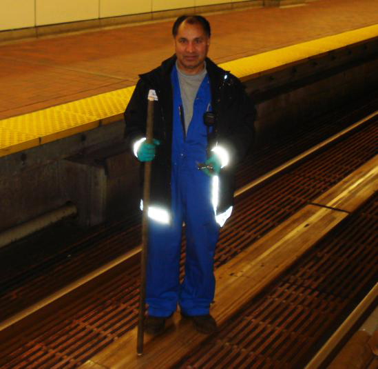 Surge Gill, Guideway Technician, ‘tapping’ LIM panels.