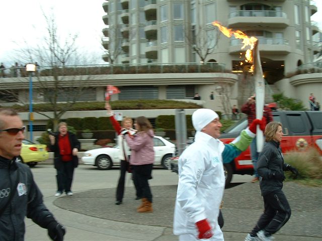The Olympic torch speeds past the north SeaBus terminal on Lonsdale Quay!