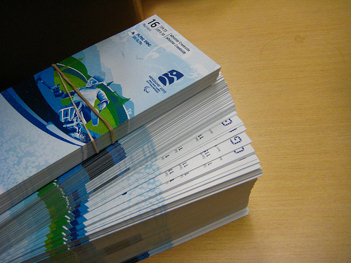 A photo of a stack of Olympic tickets. Photo by <a href=http://www.flickr.com/photos/kiwinky/4334619603/>kiwinky</a>.