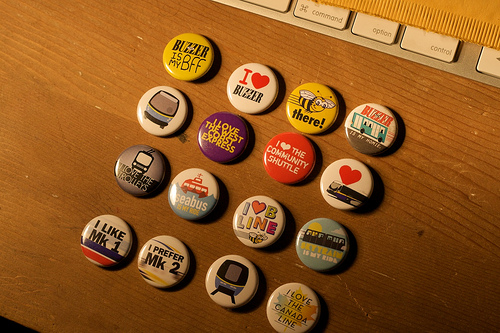 The complete set of transit buttons we have on hand. Photo by <a href=http://www.flickr.com/photos/grahamb/4252670723/in/set-72157623157537026/>Graham Ballantyne!</a>