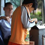 Part of the bus boarding game means counting out the correct change.