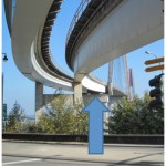 The blue arrow points to the where the work is happening. There is a bearing on each side of the cross beam.