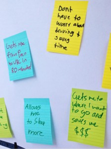 Post-its from our enormous wall poster, asking attendees to let us know what they loved about transit!
