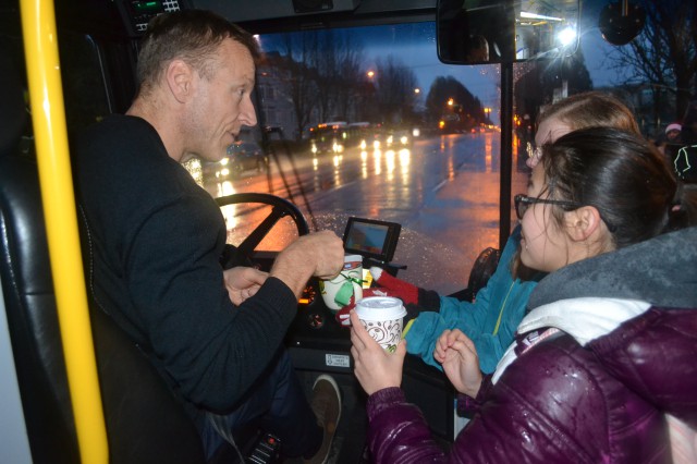 One of our operators receive a hot chocolate and a hug with holiday treats from Van Tech students