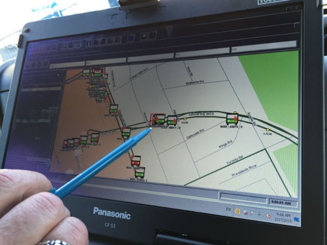 Burney using the TMAC GPS system to find buses in need of repair