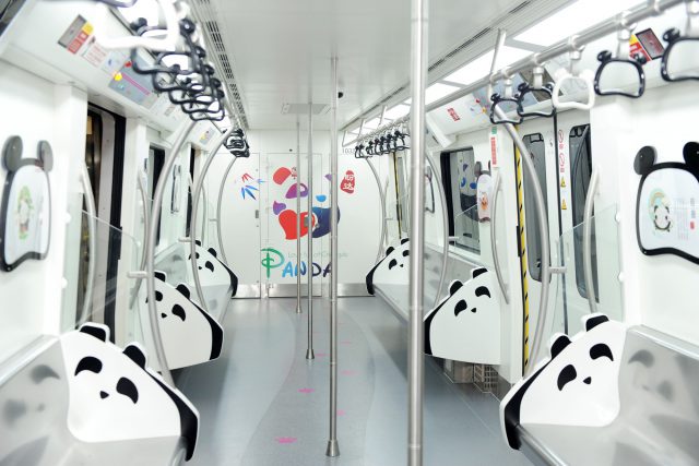 Interior view of a panda-themed subway train of subway Line 3 in Chengdu city, southwest China's Sichuan province, 31 July 2016. A train full of Panda elements ran from Taipingyuan stop at 8:30 am on Sunday (31 July 2016), marking the official opening of the first phase of subway line 3 in Chengdu city, Southwest China's Sichuan province. During the initial operation of subway line 3, the trains operated from 6:30 am to 10:50 pm by charging passengers in accordance with their travel distances. With 2 yuan ($0.3) as the base rate, the line's total 17 stops, covering 20.3 km, cost only 4 yuan. The operation hours will be adjusted in accordance with the passenger flows. "Subway line 3, running through the urban center, will shorten the commuters' one-way travel time to 34 minutes. However, this also means an upcoming traffic burden for the line, which is expected to witness a daily passenger flow of 400,000," said an insider from Chengdu Subway.