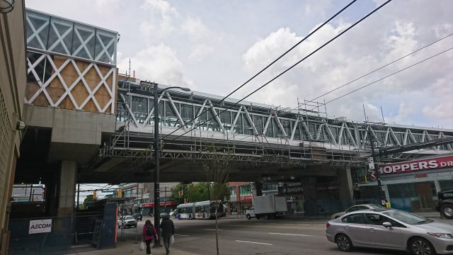 Photo of the under construction overhead walkway at Commercial–Broadway Station