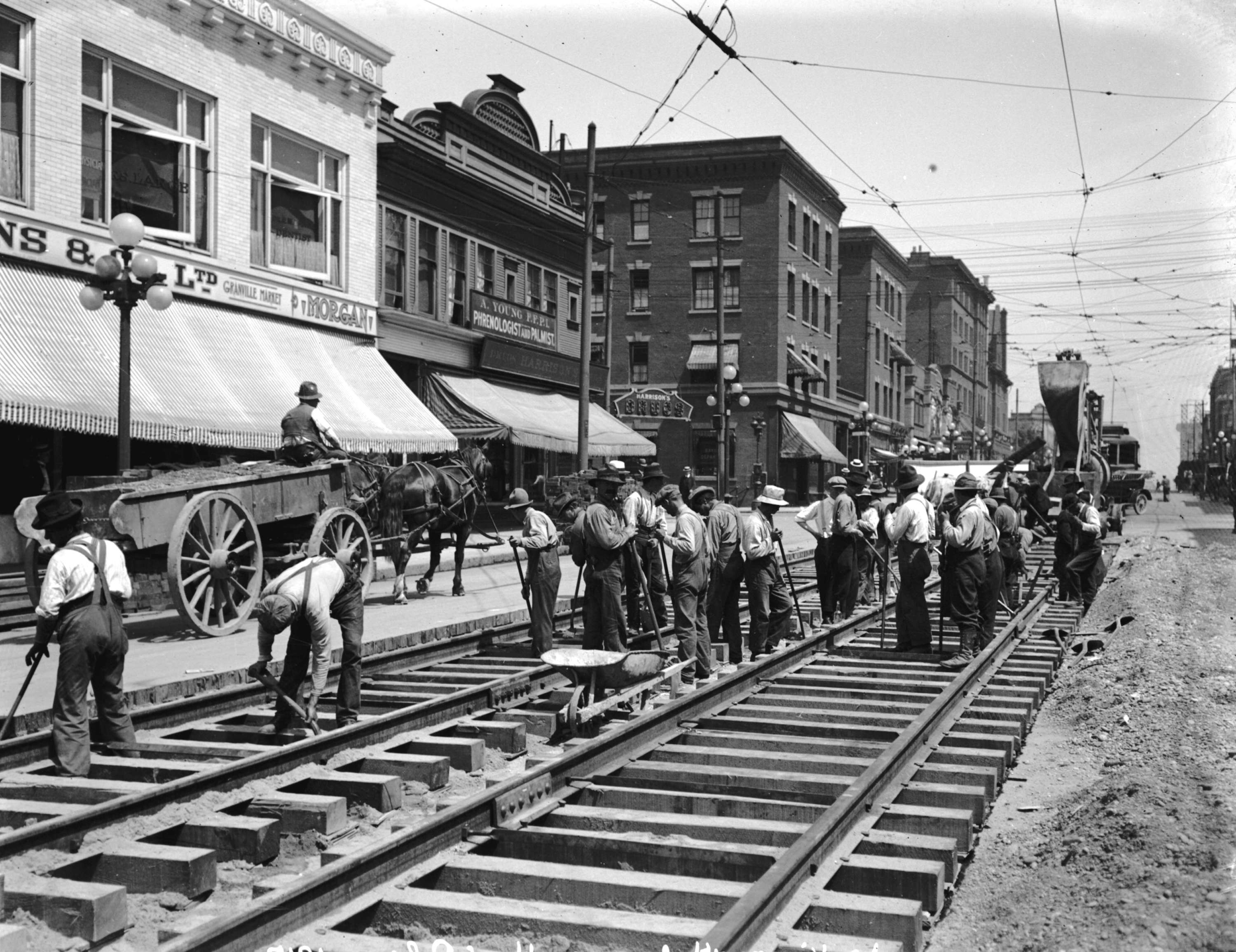 Laying the line for streetcars at Granville and Robson, Vancouver