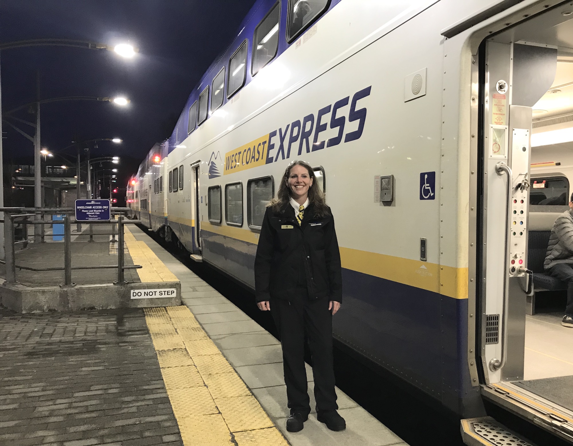 Leanna Turcotte, Train Conductor for West Coast Express stands outside passenger train