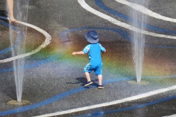 Child playing in the spray park