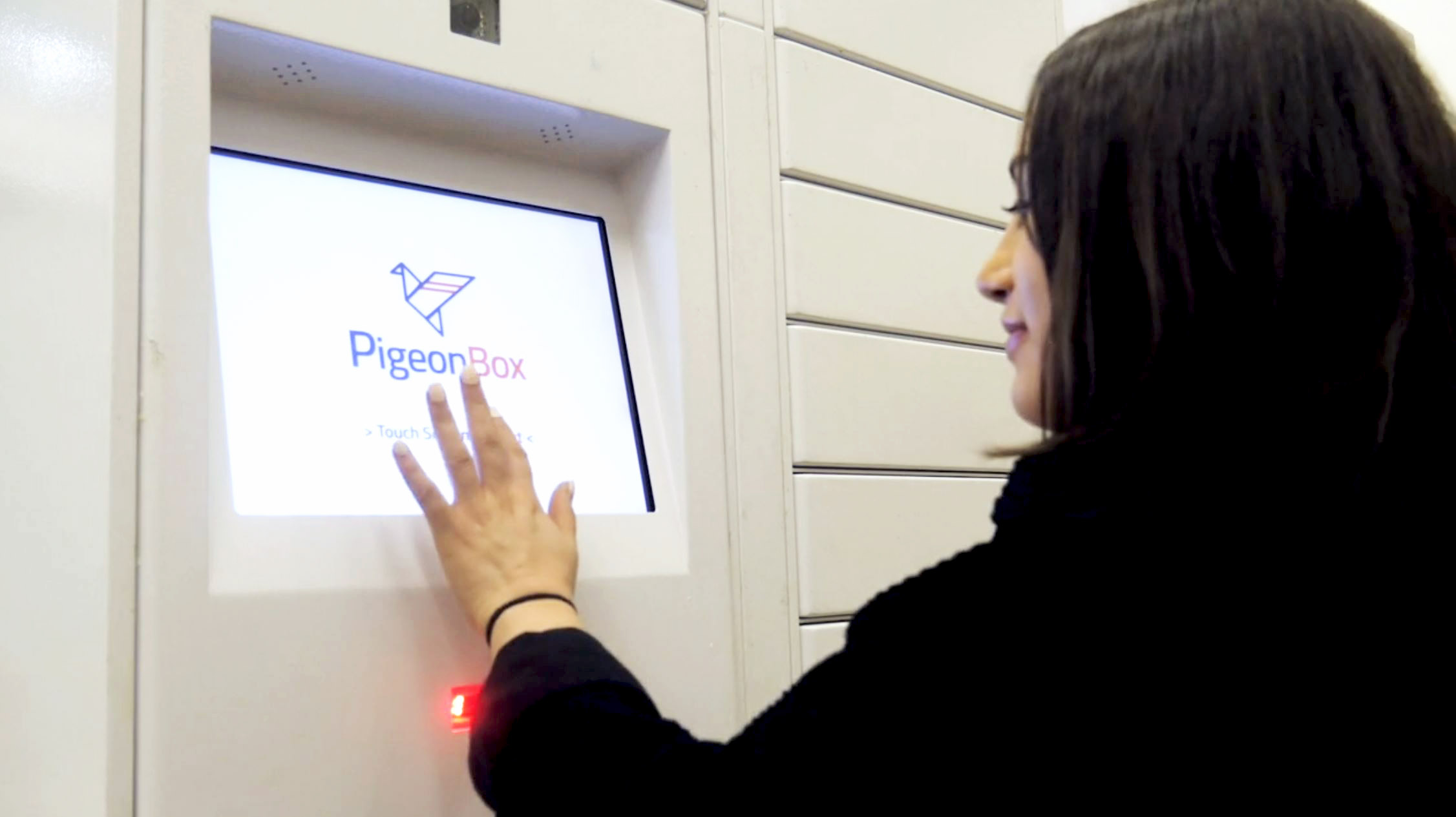 PigeoBox user touching the screen to receive an order