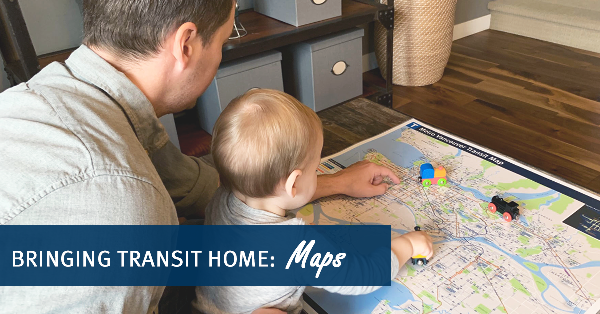 Picture of a parent and toddler looking at TransLink map