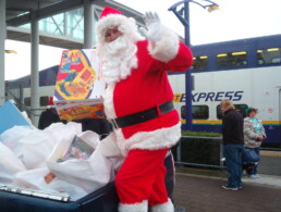 Santa sorts through the toys as part of the West Coast Express's annual Santa Train collecting toys for local Christmas bureaus.