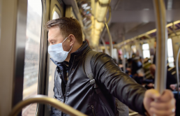 man commuting on the Skytrain with a face mask