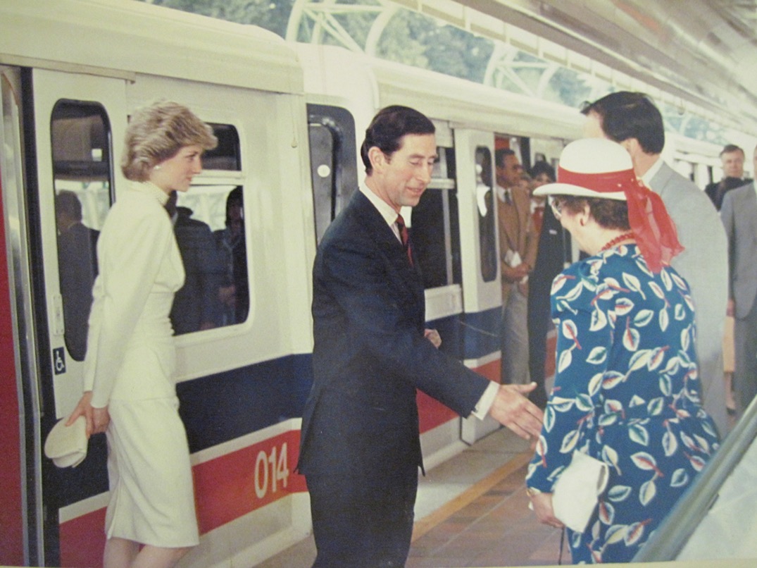 Prince Charles and Princess Diana riding the SkyTrain