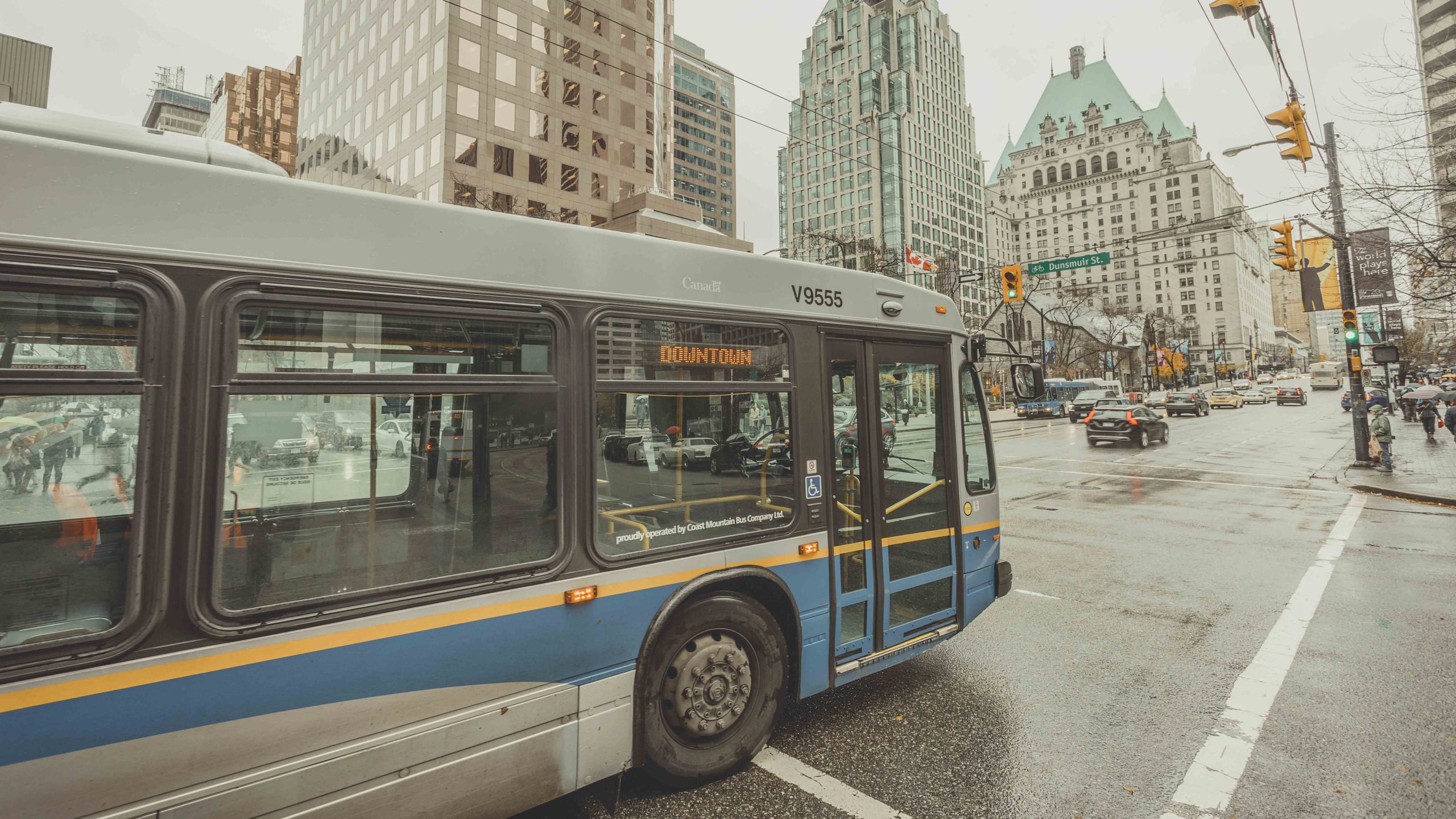A bus driving on Burrard Street in downtown Vancouver