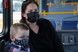 A photo of Casey and her son, who are beneficiaries of TransLink's Compass Card donations.