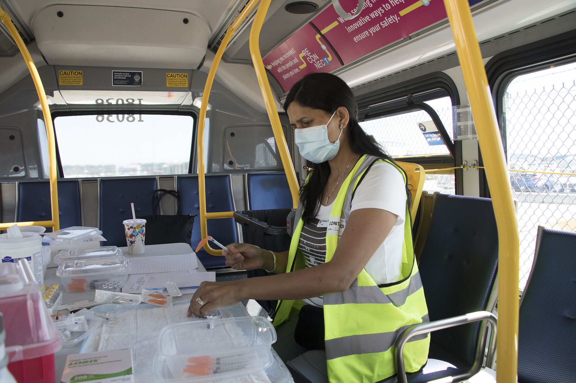 A nurse preparing onboard the mobile vaccine bus