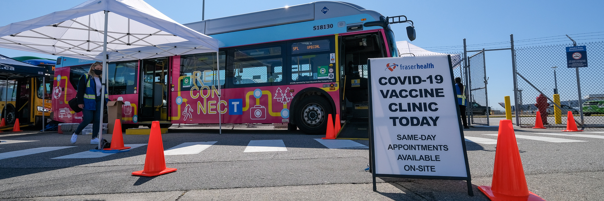 COVID-19 Vaccine Clinic Today sign in front of the mobile vaccine bus